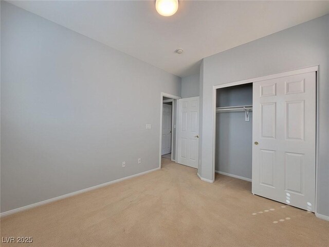 10482 Calico Pines Ave, Las Vegas, NV 89135 - unfurnished bedroom featuring light carpet and a closet