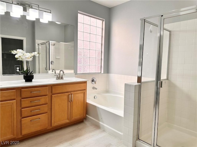 10482 Calico Pines Ave, Las Vegas, NV 89135 - bathroom featuring a stall shower, a bath, double vanity, and wood finished floors