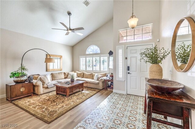 3324 Canyon Lake Dr, Las Vegas, NV 89117 - living room with high vaulted ceiling, a ceiling fan, and wood finished floors