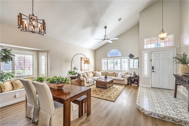 3324 Canyon Lake Dr, Las Vegas, NV 89117 - dining area featuring high vaulted ceiling, wood finished floors, a chandelier, and ceiling fan
