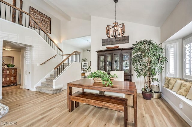 3324 Canyon Lake Dr, Las Vegas, NV 89117 - foyer entrance with stairs, high vaulted ceiling, wood finished floors, a chandelier, and a ceiling fan