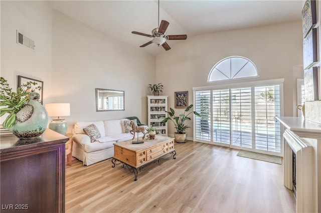 3324 Canyon Lake Dr, Las Vegas, NV 89117 - living area with a ceiling fan, light wood-type flooring, and high vaulted ceiling