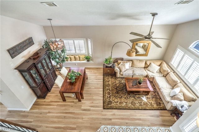 3324 Canyon Lake Dr, Las Vegas, NV 89117 - living area featuring vaulted ceiling, light wood-style floors, a chandelier, and ceiling fan