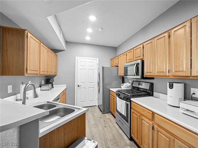 5855 Valley Dr Unit 2119, North Las Vegas, NV 89031 - kitchen with appliances with stainless steel finishes, light wood-style flooring, light countertops, a peninsula, and recessed lighting