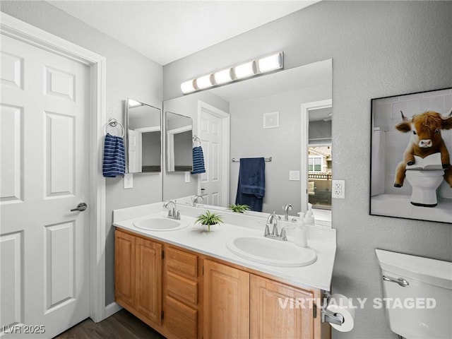 5855 Valley Dr Unit 2119, North Las Vegas, NV 89031 - full bathroom with double vanity and wood finished floors