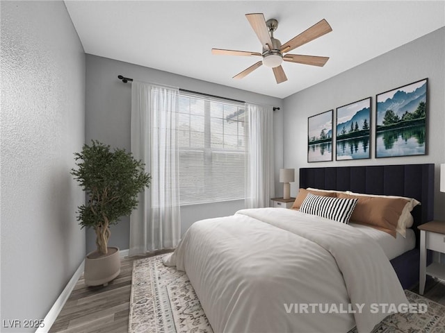 5855 Valley Dr Unit 2119, North Las Vegas, NV 89031 - bedroom featuring wood finished floors and a ceiling fan
