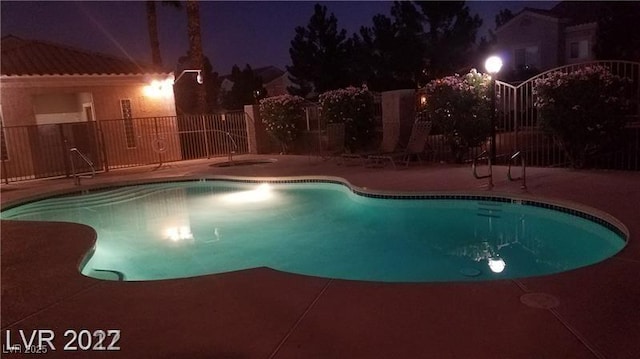 9470 Peace Way Unit 206, Las Vegas, NV 89147 - pool at twilight featuring a patio area and a community pool