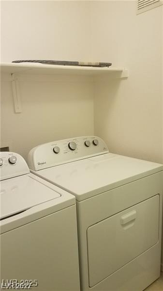 9470 Peace Way Unit 206, Las Vegas, NV 89147 - laundry area with washer and clothes dryer