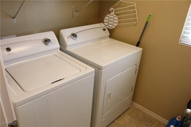 3237 Aiken St, North Las Vegas, NV 89032 - laundry room featuring independent washer and dryer and light tile patterned flooring