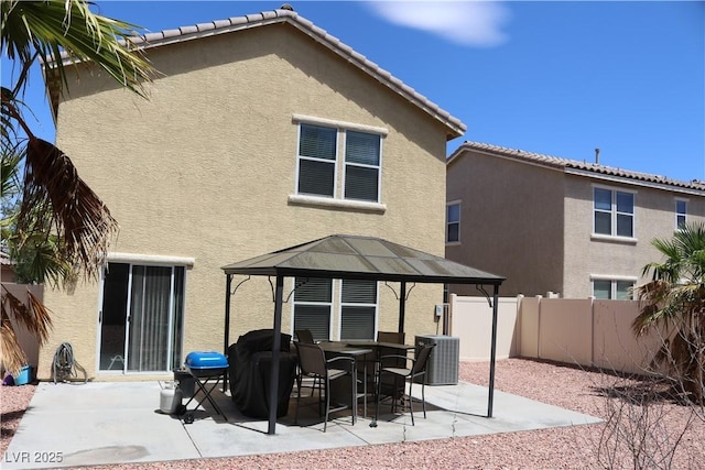 3237 Aiken St, North Las Vegas, NV 89032 - rear view of house with a gazebo, stucco siding, and a patio area