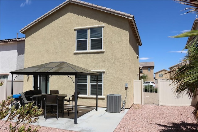 3237 Aiken St, North Las Vegas, NV 89032 - back of property featuring a gazebo, stucco siding, a patio area, and a tile roof