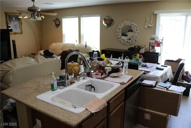 3237 Aiken St, North Las Vegas, NV 89032 - kitchen with open floor plan, a kitchen island with sink, plenty of natural light, and stainless steel dishwasher