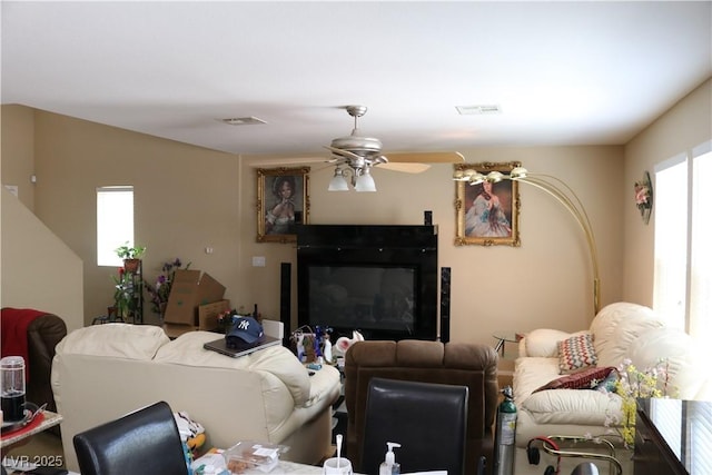 3237 Aiken St, North Las Vegas, NV 89032 - living room with a glass covered fireplace and ceiling fan