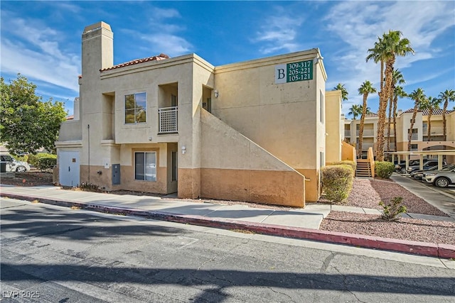 5000 Red Rock St Unit 105, Las Vegas, NV 89118 - view of building exterior featuring stairway