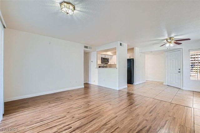 5000 Red Rock St Unit 105, Las Vegas, NV 89118 - unfurnished living room with light wood-type flooring and a ceiling fan