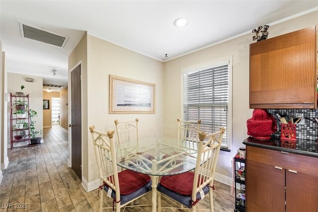 4544 Plaza De Vista St, Las Vegas, NV 89120 - dining space with light wood-type flooring and ornamental molding