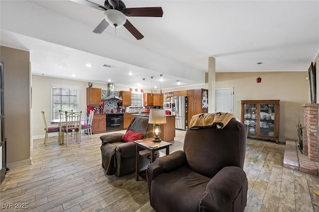 4544 Plaza De Vista St, Las Vegas, NV 89120 - living area with light wood-style floors, a fireplace with raised hearth, ceiling fan, and recessed lighting