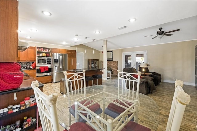 4544 Plaza De Vista St, Las Vegas, NV 89120 - dining space with light wood finished floors, french doors, a ceiling fan, recessed lighting, and vaulted ceiling