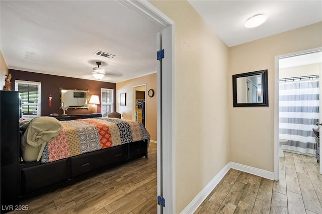4544 Plaza De Vista St, Las Vegas, NV 89120 - bedroom with wood finished floors and connected bathroom