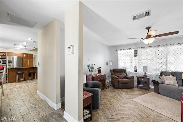 4544 Plaza De Vista St, Las Vegas, NV 89120 - living area featuring ceiling fan and parquet floors