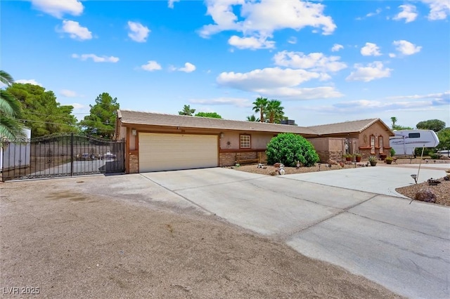 4544 Plaza De Vista St, Las Vegas, NV 89120 - ranch-style house with an attached garage, concrete driveway, stucco siding, and a gate