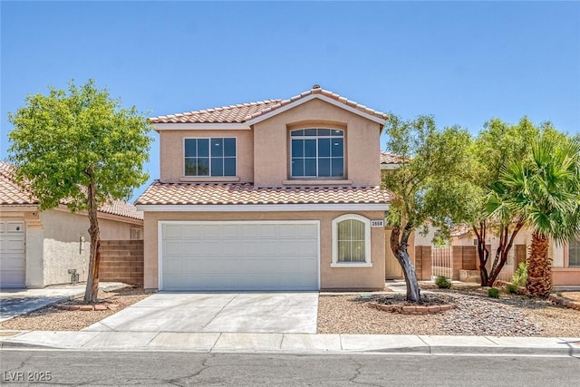 3664 Summer Picnic Ct, Las Vegas, NV 89147 - mediterranean / spanish house featuring a tiled roof, an attached garage, stucco siding, and concrete driveway