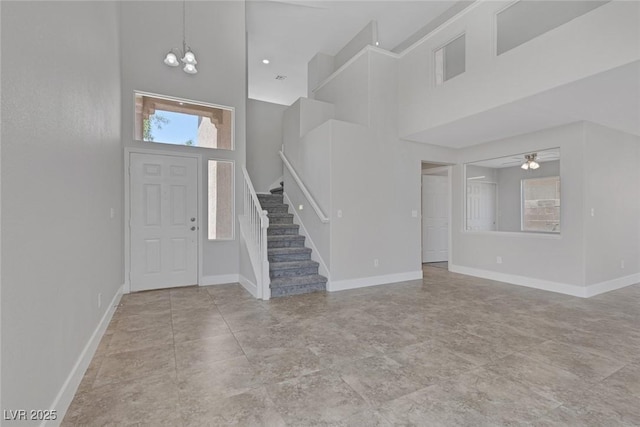 3664 Summer Picnic Ct, Las Vegas, NV 89147 - entryway with a towering ceiling, stairway, a chandelier, and a ceiling fan
