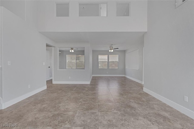 3664 Summer Picnic Ct, Las Vegas, NV 89147 - unfurnished living room with ceiling fan and baseboards
