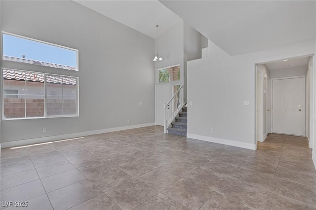 3664 Summer Picnic Ct, Las Vegas, NV 89147 - spare room featuring high vaulted ceiling, stairway, and plenty of natural light