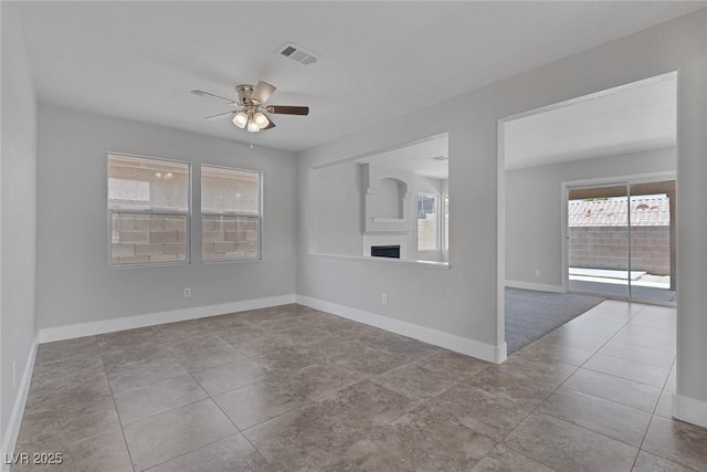3664 Summer Picnic Ct, Las Vegas, NV 89147 - empty room with ceiling fan and tile patterned floors