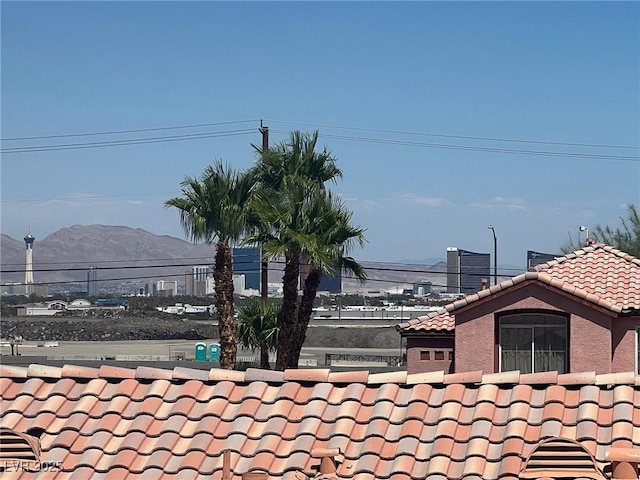 3664 Summer Picnic Ct, Las Vegas, NV 89147 - exterior view of a tile roof and mountains