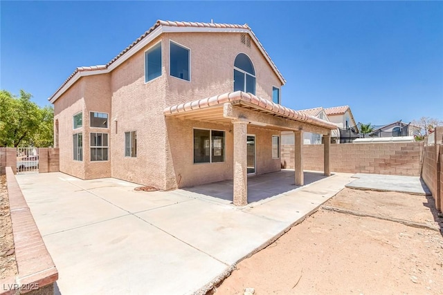 3664 Summer Picnic Ct, Las Vegas, NV 89147 - back of house featuring a patio, a fenced backyard, stucco siding, and a tiled roof