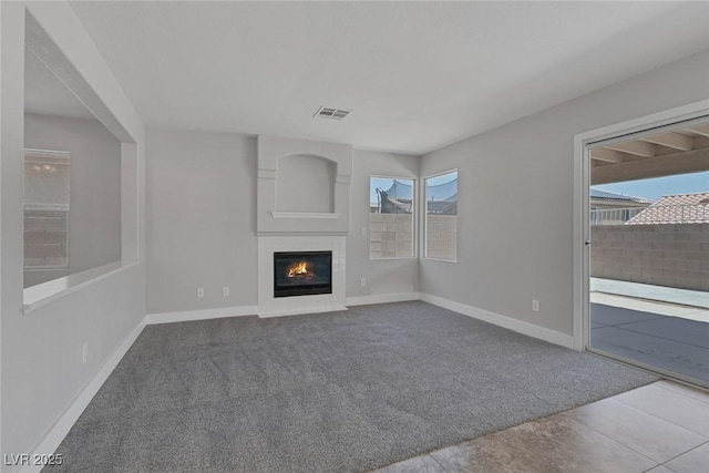3664 Summer Picnic Ct, Las Vegas, NV 89147 - unfurnished living room featuring carpet floors and a glass covered fireplace
