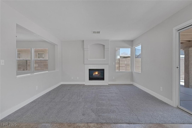 3664 Summer Picnic Ct, Las Vegas, NV 89147 - unfurnished living room with carpet flooring and a glass covered fireplace