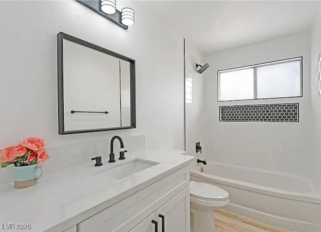 5321 Westleigh Ave, Las Vegas, NV 89146 - full bathroom with vanity, wood finished floors, and  shower combination