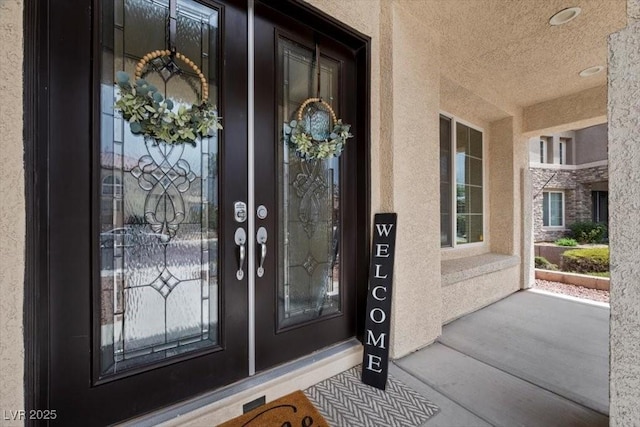 7012 Geese Gathering St, North Las Vegas, NV 89084 - entrance to property featuring stucco siding and a porch