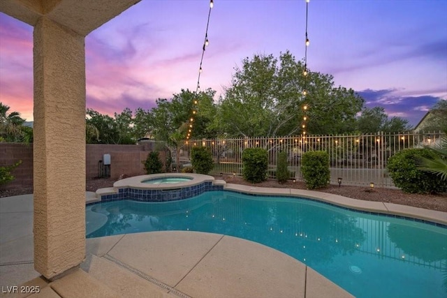 7012 Geese Gathering St, North Las Vegas, NV 89084 - view of swimming pool with an in-ground hot tub, a fenced backyard, and a patio area