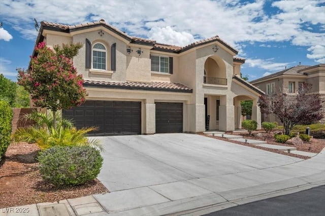 7012 Geese Gathering St, North Las Vegas, NV 89084 - mediterranean / spanish house featuring a tile roof, a garage, and stucco siding