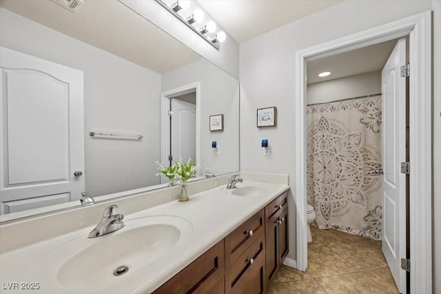 7012 Geese Gathering St, North Las Vegas, NV 89084 - full bath featuring double vanity, tile patterned flooring, and curtained shower