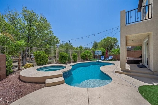 7012 Geese Gathering St, North Las Vegas, NV 89084 - view of pool featuring a patio, a fenced backyard, and a pool with connected hot tub