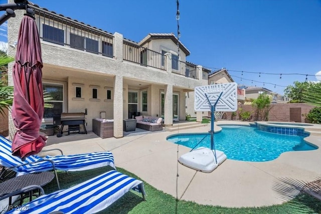 7012 Geese Gathering St, North Las Vegas, NV 89084 - view of pool featuring a patio area, an outdoor hangout area, a fenced backyard, and a pool with connected hot tub