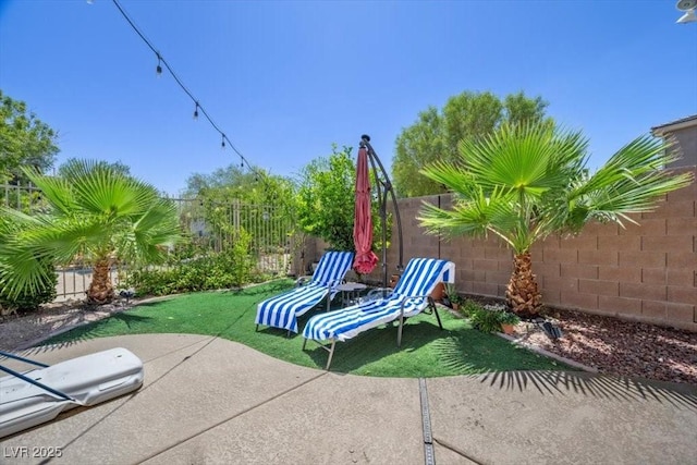 7012 Geese Gathering St, North Las Vegas, NV 89084 - fenced backyard with a patio area