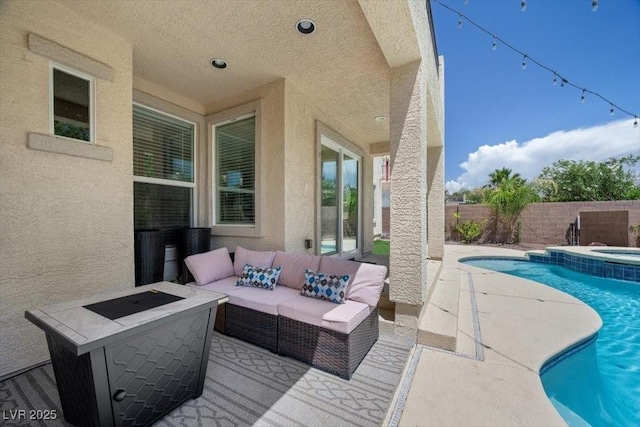 7012 Geese Gathering St, North Las Vegas, NV 89084 - view of swimming pool featuring a patio, a fenced backyard, an outdoor living space with a fire pit, and a pool with connected hot tub