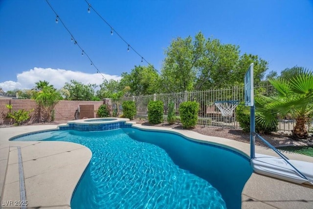 7012 Geese Gathering St, North Las Vegas, NV 89084 - view of swimming pool with a fenced backyard, a pool with connected hot tub, and a patio