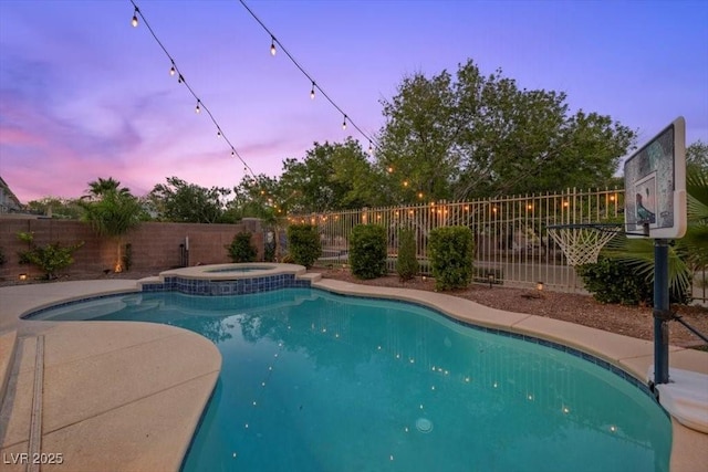 7012 Geese Gathering St, North Las Vegas, NV 89084 - view of swimming pool featuring a fenced backyard and a pool with connected hot tub