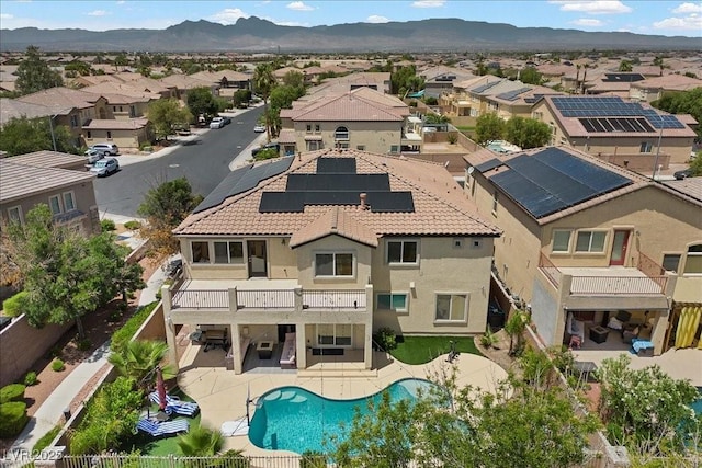 7012 Geese Gathering St, North Las Vegas, NV 89084 - aerial view of residential area with a pool and a mountain backdrop