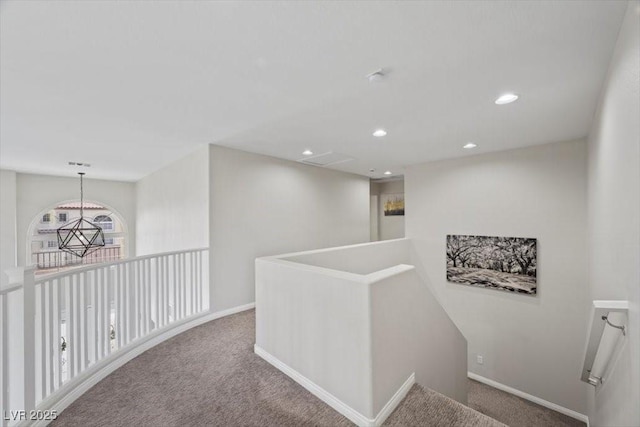 7012 Geese Gathering St, North Las Vegas, NV 89084 - hallway with carpet floors, an upstairs landing, and recessed lighting