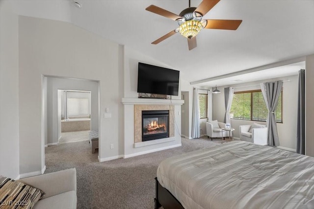 7012 Geese Gathering St, North Las Vegas, NV 89084 - carpeted bedroom featuring lofted ceiling, a tile fireplace, and a ceiling fan