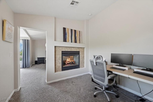 7012 Geese Gathering St, North Las Vegas, NV 89084 - carpeted home office with a multi sided fireplace and baseboards