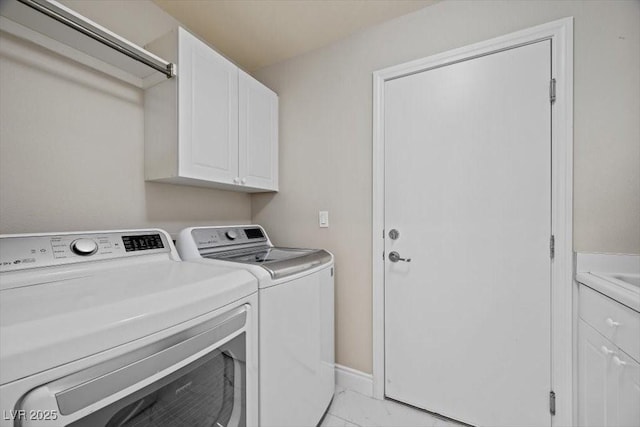 7012 Geese Gathering St, North Las Vegas, NV 89084 - laundry room with light marble finish flooring, washing machine and dryer, and cabinet space